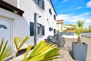 a group of bikes parked next to a building at Apartments ROSINI, 300m from the beach with shared tavern and bikes, Nin in Nin