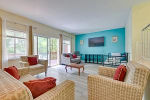 a living room with two couches and a tv at LAKE GEORGE FAMILY VACATION HOME in Lake George