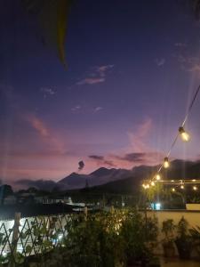 a view of a city at night at Hotel & Restaurante Teresàs Bistro in Antigua Guatemala