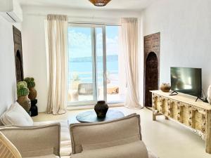 a living room with a view of the ocean at Casa de oro Lujo in Sozopol