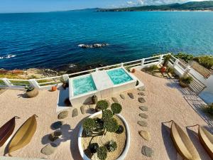 an overhead view of a swimming pool and the ocean at Casa de oro Lujo in Sozopol
