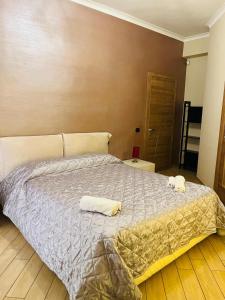 Ένα ή περισσότερα κρεβάτια σε δωμάτιο στο Lalla Home