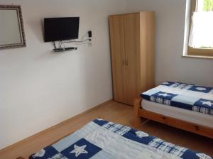 Postel nebo postele na pokoji v ubytování Pension Lindengarten