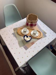 a table with a hat and a plate of food on it at Studio Sparky in Mostar