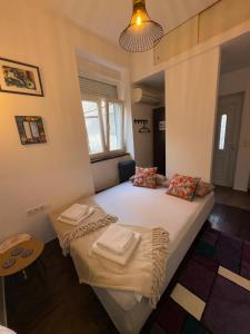 a bedroom with a bed with towels on it at Studio Sparky in Mostar
