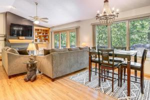 a living room with a couch and a dining room at 4 Mi to Massanutten Resort Family Home with Views! in McGaheysville