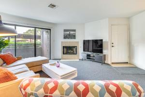 a living room with a couch and a tv at 5 Mi to Las Vegas Strip Condo with Community Perks! in Las Vegas