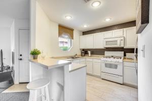 a kitchen with white cabinets and a counter top at 5 Mi to Las Vegas Strip Condo with Community Perks! in Las Vegas