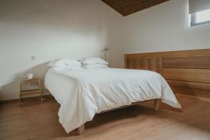 Postel nebo postele na pokoji v ubytování Abrigos do Castelo