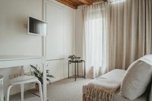 TV a/nebo společenská místnost v ubytování Abrigos do Castelo