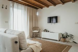 TV a/nebo společenská místnost v ubytování Abrigos do Castelo