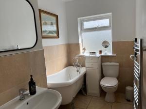 Koupelna v ubytování Westport Holiday Home + 14 fotografií