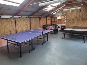 a ping pong room with two ping pong tables at Kwatery U Marka in Gowidlino
