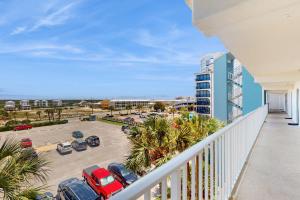 a balcony with a view of a parking lot at Island Shores 455 in Gulf Shores +21 photos