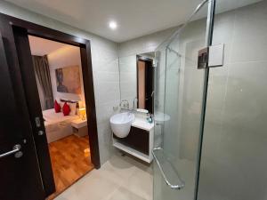 a bathroom with a sink and a glass shower at EMERALD TERRACE CONDO 52-FAMILY 1 Bedroom POOL VIEW in Patong Beach