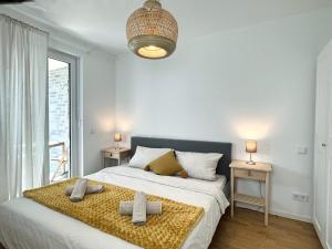 a bedroom with a bed with two crosses on it at HolidayHome Apartments I Airport Deluxe Condo with Terrace in Schönefeld