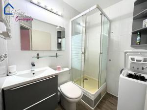 a bathroom with a toilet and a sink and a shower at L'Empereur Colliourenc in Collioure