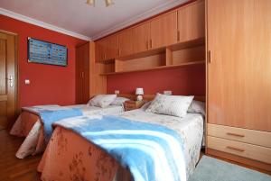 Ένα ή περισσότερα κρεβάτια σε δωμάτιο στο Apartamento As Carolinas