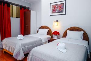 Katil atau katil-katil dalam bilik di Hotel Mayros