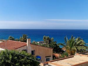 a view of the ocean from a building at Duplex trouville à 2 pas de la plage in Aïn El Turk