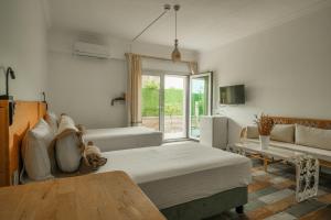 a large room with a bed and a couch at La Vida otel in Urla +69 photos