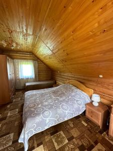 Postel nebo postele na pokoji v ubytování Садиба "Джерело"