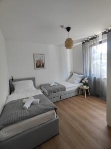 Ένα ή περισσότερα κρεβάτια σε δωμάτιο στο Parkblick Apartment Weißenthurm Nähe Koblenz