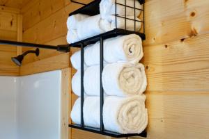 a bunch of towels on a towel rack on a wall at Gentle Ben's Chalet in Murphy +59 photos