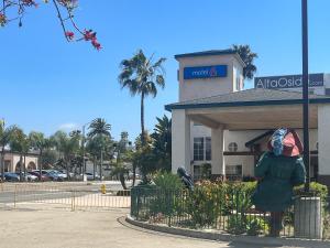 a person is standing in front of a building at Oceanside, CA – Marina / Camp Pendleton in Oceanside