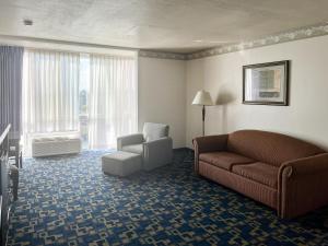 a living room with a couch and a chair at Oceanside, CA – Marina / Camp Pendleton in Oceanside