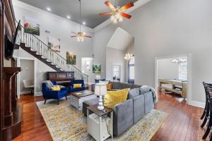 a living room with a couch and a piano at Downtown Estate Luxury Property in Hammond