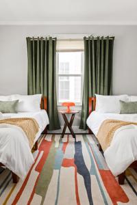 a room with two beds and a window at 4BD near Indy 500 Speedway - BBQ & Backyard in Indianapolis