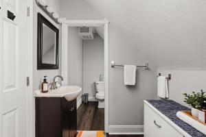 a bathroom with a sink and a toilet at 4BD near Indy 500 Speedway - BBQ & Backyard in Indianapolis +37 photos