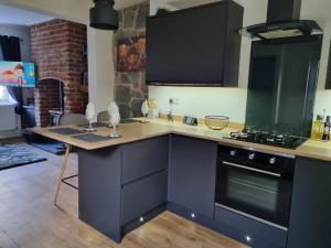 a kitchen with a counter top and a stove at No 3 Waterloo Place in Welshpool