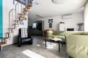 a living room with a couch and a table at Bandiland Szigetmonostor Horány in Szigetmonostor