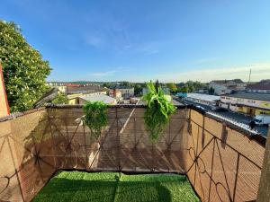 a brick wall with plants on top of it at Vintage Rooms in Przemyśl