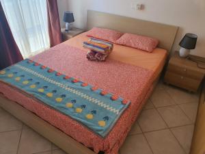 a bedroom with a bed with a cake on it at Capo Verde Club - Ca Francesca in Santa Maria