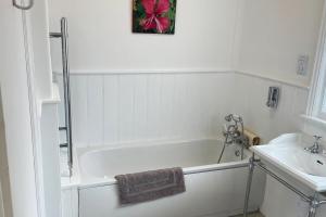 Koupelna v ubytování Heathcote Llandudno + 34 fotografií