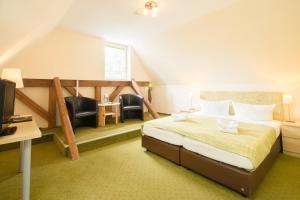 Llit o llits en una habitació de Altes Forsthaus Braunlage