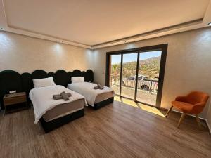 Postel nebo postele na pokoji v ubytování Villa de Luxe Tabaktoukt Agadir 6 SUITES FAMILLE UNIQUEMENT