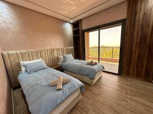Postel nebo postele na pokoji v ubytování Villa de Luxe Tabaktoukt Agadir 6 SUITES FAMILLE UNIQUEMENT