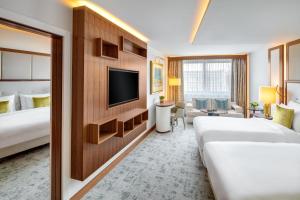 A bed or beds in a room at Kempinski Hotel Corvinus Budapest