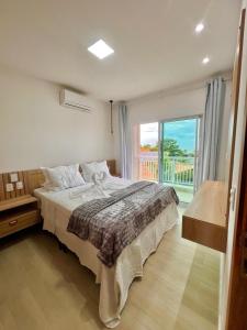 Katil atau katil-katil dalam bilik di Del Mar SG Apartment
