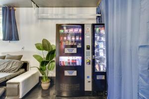 a vending machine in a living room next to a couch at Boise Home with Hot Tub, Yard about 5 Mi to Dtwn! in Boise