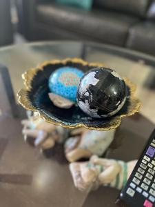 a person holding a plate of balls on a table at Las Palomas Beach & Golf Resort in Puerto Peñasco