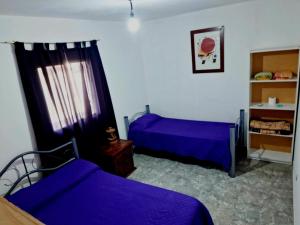 Postel nebo postele na pokoji v ubytování Departamentos Reinoso + 7 fotografií