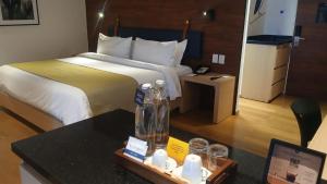 Postel nebo postele na pokoji v ubytování voco Guadalajara Neruda by IHG