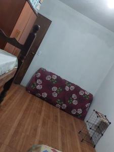 a suitcase sitting on the floor in a room at Sítio Rodrigues in Pedro Leopoldo +9 photos