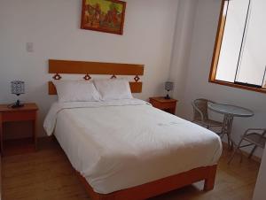 Cama o camas de una habitación en Qente Wings
