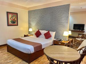 Postel nebo postele na pokoji v ubytování The VIP Hotel